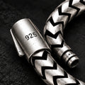 Close-up of bracelet clasp with visible 925 marking and chevron links