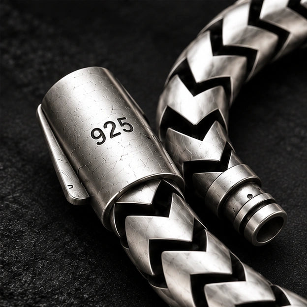 Close-up of bracelet clasp with visible 925 marking and chevron links